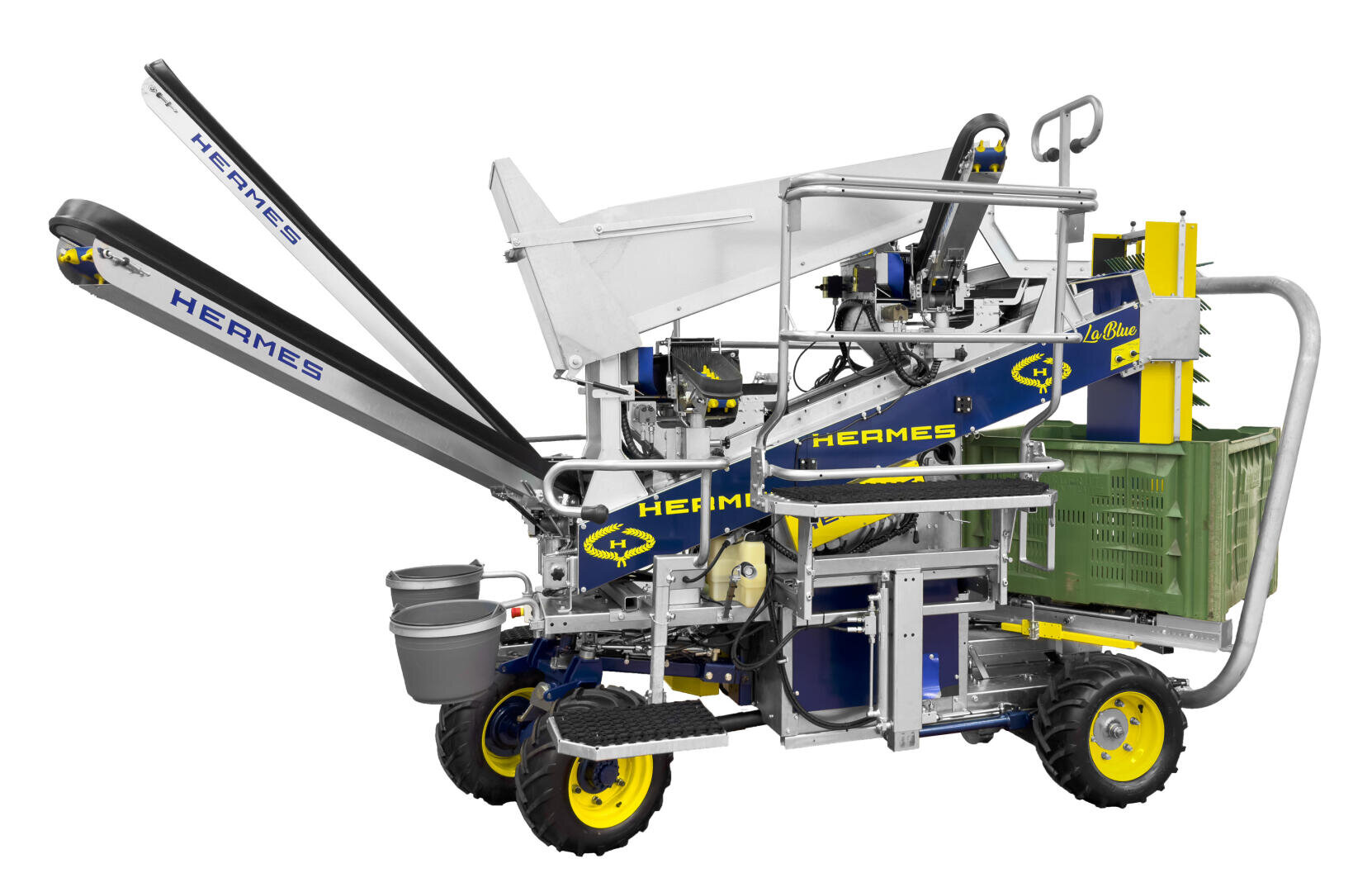 Eine moderne blau-gelbe Erntemaschine mit Förderbändern, Kisten und Schaufeln, die für den landwirtschaftlichen Einsatz konzipiert ist. Die Maschine ist mit HEARMES beschriftet und hat Räder für die Mobilität.