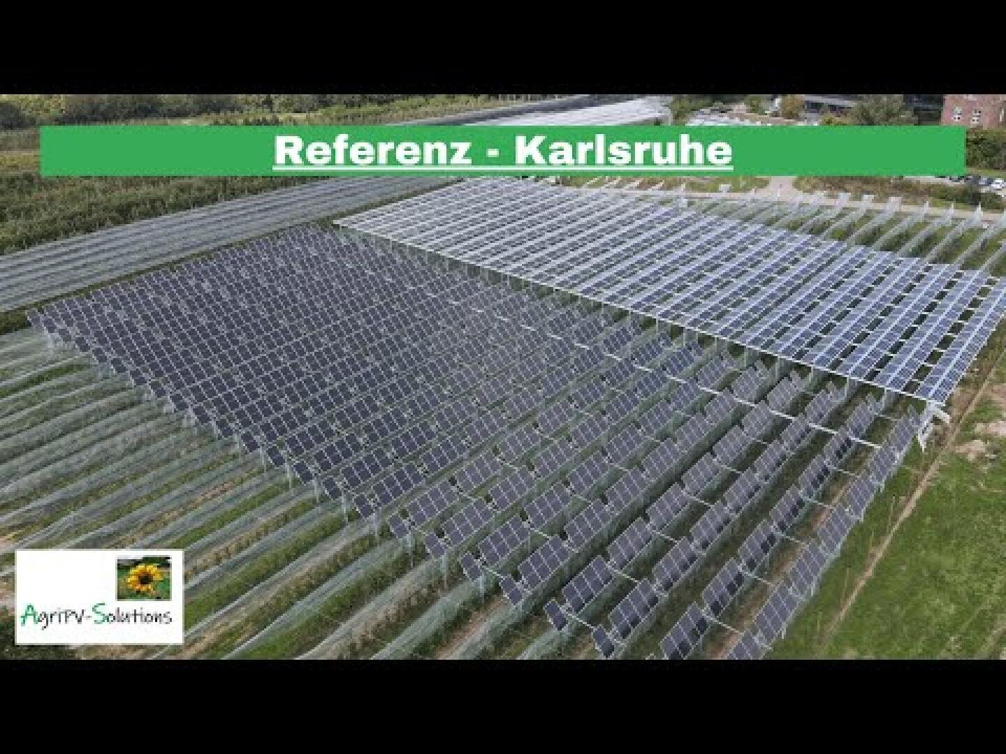 Aerial view of solar modules installed over agricultural fields near Karlsruhe. The image shows a green banner with the text Reference - Karlsruhe and a logo for AgriPV-Solutions in the bottom left corner.